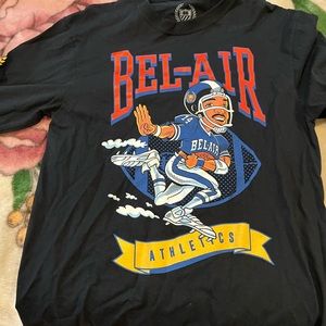 Large Bel-Air shirt. I wear XL now. Used twice but had it for 2 years now.
